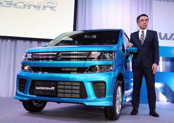 February 1, 2017, Tokyo, Japan - Japan s minicar maker Suzuki Motor president Toshihiro Suzuki displays the mini wagon Wagon R which has 660cc engine or engine electric-motor hybrid system to drive roomy body in Tokyo on February 1, 2017. The new Wagon R has various safety devices and minicar s first head-up display.  (lwxa007943)