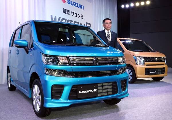 February 1, 2017, Tokyo, Japan - Japan s minicar maker Suzuki Motor president Toshihiro Suzuki displays the mini wagon Wagon R which has 660cc engine or engine electric-motor hybrid system to drive roomy body in Tokyo on February 1, 2017. The new Wagon R has various safety devices and minicar s first head-up display.  (lwxa007944)