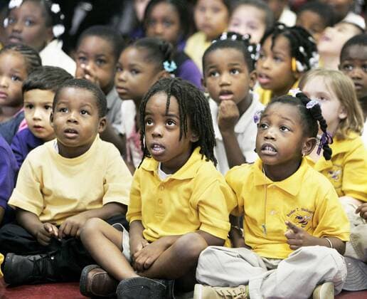 CAPTION (11 09 05 - TAMPA): (2) Ronell James (cq from teacher 4 yrs.old left), Ja Quez Anderson (cq from teacher 4 yrs.old center), and Sasha Estera (cq from teacher 4 yrs.old right), listen intently with their school mates as storyteller Linda Gorham (cq) tells them the story of Tacky the Penguin, on Wednesday - ZUMAs70_ 20051109_baf_s70_047 Copyright: xStxPetersburgxTimesx