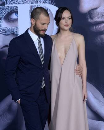 Cast members Jamie Dornan and Dakota Johnson attend the Fifty Shades Darker premiere at the Ace Hotel Theatre in Los Angeles on February 2, 2017. Storyline: While Christian wrestles with his inner demons, Anastasia must confront the anger and envy of the women who came before her.  LAP2017020210 JIMxRUYMEN