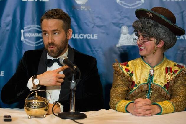 Actor Ryan Reynolds (L) answers questions from reporters with Harvard student Dan Milaschewski in costume to his right after Reynolds was awarded the Harvard University Hasty Pudding Theatricals 2017 Man of the Year inside Farkas Hall in Cambridge, Massachusetts on February 3, 2017.  BOS20170203003 MATTHEWxHEALEY