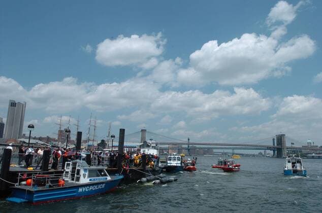 Jun 14, 2005; New York, NY, USA; Police and firefighters at work following a helicopter crash into the East River near the Wall St. Heliport. All six passengers and one pilot survived. The sightseeing helicopter was carrying six tourists from Australia, England and France. Mandatory  - ZUMApter 20050614_sim_b09_383 Copyright: xBryanxSmithx