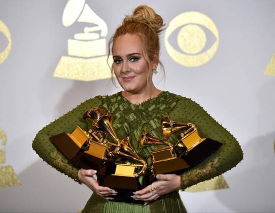 Singer Adele appears backstage with her awards for Album Of The Year and Best Pop Vocal Album for 25 and Song Of The Year, Record Of The Year and Best Pop Solo Performance for Hello during the 59th annual Grammy Awards held at Staples Center in Los Angeles on February 12, 2017.  LAP201702121446 CHRISTINExCHEW