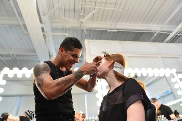 A model gets her makeup done backstage at the Katty Xiomara fashion show at New York Fashion Week: Pier 59 Studios on February 13, 2017 in New York City.  NYP201702131000 ANDREAxHANKS