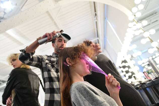 A model gets her hair done backstage at the Katty Xiomara fashion show at New York Fashion Week: Pier 59 Studios on February 13, 2017 in New York City.  NYP201702131001 ANDREAxHANKS