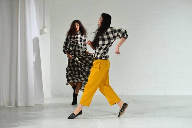 A model walks on the runway as a dancer performs at the Mara Hoffman fashion show at New York Fashion Week: The Shows at Shop Studios on February 13, 2017 in New York City.  NYP201702131041 ANDREAxHANKS