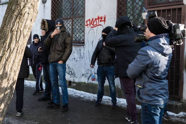 Attack on AFC Ajax fans in Warsaw An exterior view of the Chmury (Clouds) club in Warsaw s northern Praga district where AFC Ajax fans were attacked overnight on February 16, 2016 in Warsaw, Poland. It was stated, that a group of about a 50 black-clothed emblemless attackers threw bottles and stones at the club where the Dutch fans, who are in Warsaw for UEFA Europa League Legia vs. AFC Ajax match, were gathering at night. The group of aggressors fled the site just before the arrival of police while Ajax fans barricaded themselves inside the hostel where they are staying. No causalities were reported. Ajax fans are transported to the match. EN_01245927_0023 