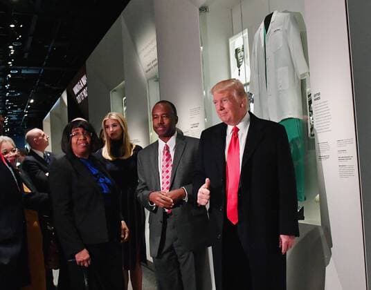 February 21, 2017 - Washington, District of Columbia, United States of America - United States President Donald Trump looks at the Ben Carson exhibit with Ben Carson and Ivanka Trump (center) as he visits the Smithsonian National Museum of African American History and Culture in Washington, DC on February 21, 2017. .Credit: Pool via CNP Washington United States of America - ZUMAs152 20170221_zaa_s152_001 Copyright: xKevinxDietschx