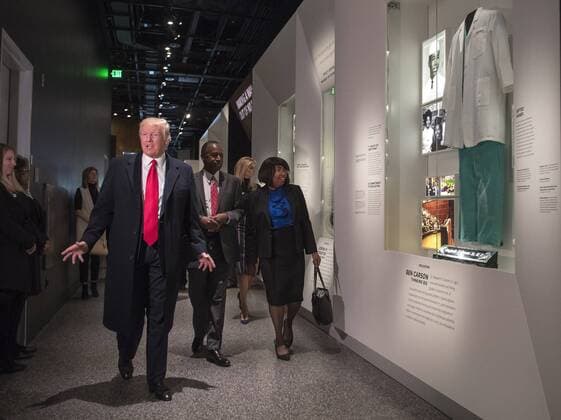 President Donald Trump, joined by Dr. Ben Carson and his wife Candy, visit the Ben Carson exhibit as they tour the Smithsonian National Museum of African American History & Culture in Washington, D.C. on February 21, 2017.  WAP20170221305 KEVINxDIETSCH