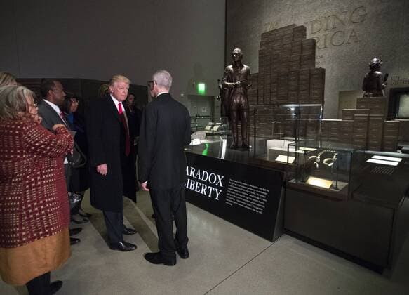 President Donald Trump is joined by David Skorton, Secretary of the Smithsonian, as he tours the Smithsonian National Museum of African American History & Culture in Washington, D.C. on February 21, 2017.  WAP20170221301 KEVINxDIETSCH