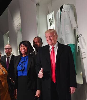 February 21, 2017 - Washington, District of Columbia, United States of America - United States President Donald Trump looks at the Ben Carson exhibit with Ben Carson (back,center) as he visits the Smithsonian National Museum of African American History and Culture in Washington, DC on February 21, 2017. Photo Credit: CNP AdMedia Washington United States of America - ZUMAa123 20170221_zaa_a123_011 Copyright: xKevinxDietschx