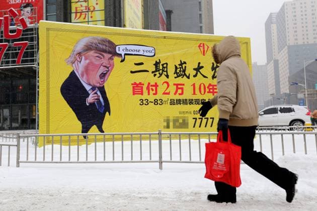 February 22, 2017 - Shenyang, Shenyang, China - Shenyang, CHINA-February 22 2017: (EDITORIAL USE ONLY. CHINA OUT) ..The cartoon portrait of American president Donald Trump can be seen on an advertisement board of real estate company in Shenyang, northeast China s Liaoning Province, February 22nd, 2017. The advertisement, which might violate the portrait rights of Donald Trump, attracts attention of many passers-by. Shenyang China  - ZUMAs145 20170222_zaa_s145_097 Copyright: xChenxHongbox