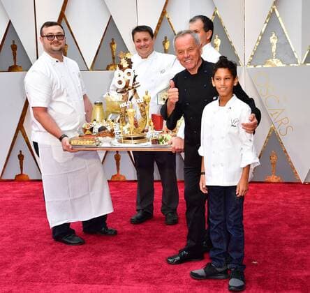 Chef Wolfgang Puck (L) and son Oliver (R) arrives with an assortment of Oscar-themed food on the red carpet for the 89th annual Academy Awards at the Dolby Theatre in the Hollywood section of Los Angeles on February 26, 2017.  LAP2017022607 KEVINxDIETSCH