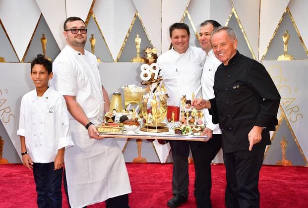 Chef Wolfgang Puck (R) and son Oliver (L) arrives with an assortment of Oscar-themed food on the red carpet for the 89th annual Academy Awards at the Dolby Theatre in the Hollywood section of Los Angeles on February 26, 2017.  LAP2017022608 KEVINxDIETSCH