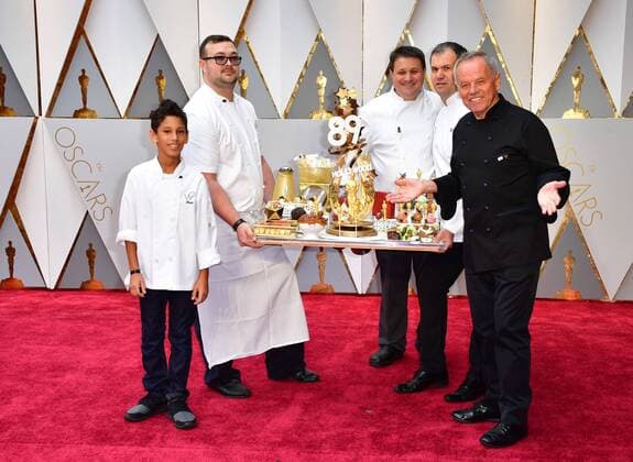 Chef Wolfgang Puck (R) and son Oliver (L) arrives with an assortment of Oscar-themed food on the red carpet for the 89th annual Academy Awards at the Dolby Theatre in the Hollywood section of Los Angeles on February 26, 2017.  LAP2017022609 KEVINxDIETSCH
