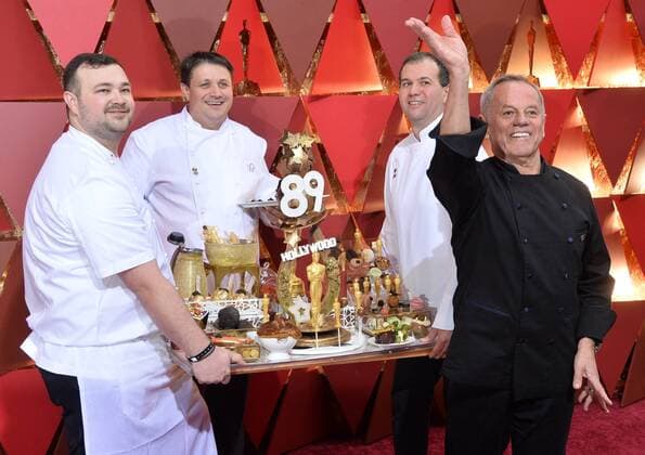 Chef Wolfgang Puck (R) arrives on the red carpet for the 89th annual Academy Awards at the Dolby Theatre in the Hollywood section of Los Angeles on February 26, 2017.  LAP20170226323 JIMxRUYMEN