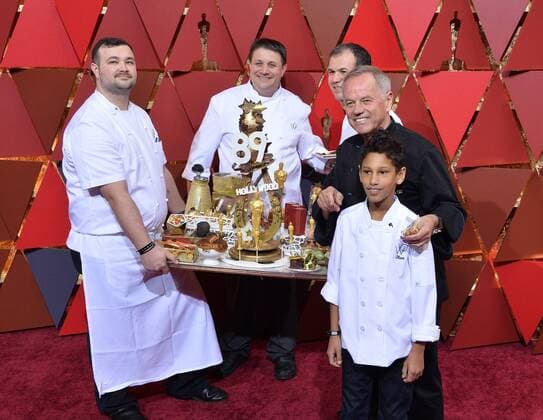 Chef Wolfgang Puck (2nd R) arrives on the red carpet for the 89th annual Academy Awards at the Dolby Theatre in the Hollywood section of Los Angeles on February 26, 2017.  LAP20170226324 JIMxRUYMEN