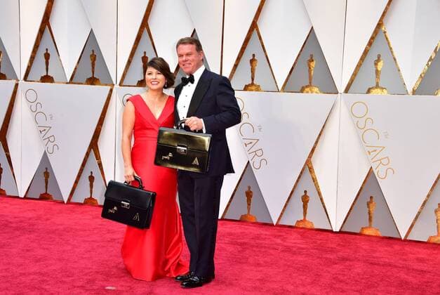 The team from Price Waterhouse Cooper, Martha Ruiz and Brian Cullinan, arrive with the Oscar voting results on the red carpet for the 89th annual Academy Awards at the Dolby Theatre in the Hollywood section of Los Angeles on February 26, 2017.  LAP2017022677 KEVINxDIETSCH