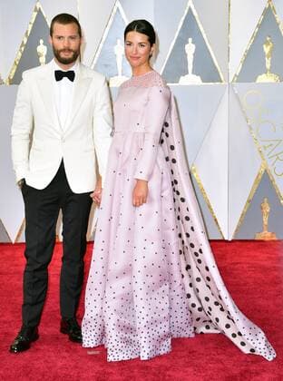 Actors Jamie Dornan and Amelia Warner arrives on the red carpet for the 89th annual Academy Awards at the Dolby Theatre in the Hollywood section of Los Angeles on February 26, 2017.  LAX20170226911 KEVINxDIETSCH