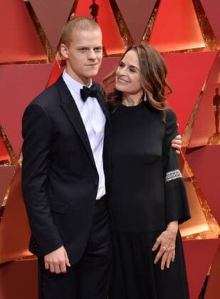 Actor Lucas Hedges (L) and his mother Susan Bruce Titman arrive on the red carpet for the 89th annual Academy Awards at the Dolby Theatre in the Hollywood section of Los Angeles on February 26, 2017.  LAP20170226865 JIMxRUYMEN