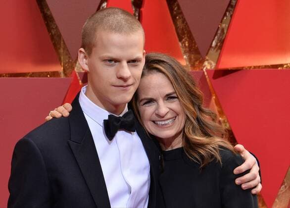 Actor Lucas Hedges (L) and his mother Susan Bruce Titman arrive on the red carpet for the 89th annual Academy Awards at the Dolby Theatre in the Hollywood section of Los Angeles on February 26, 2017.  LAP20170226869 JIMxRUYMEN