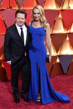 Michael J. Fox (L) and Tracy Pollan arrive on the red carpet for the 89th annual Academy Awards at the Dolby Theatre in the Hollywood section of Los Angeles on February 26, 2017.  LAP20170226063 JIMxRUYMEN