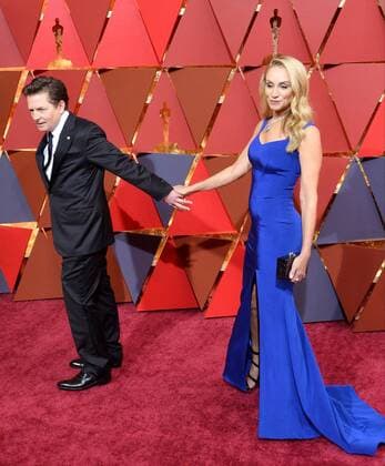 Actors Michael J. Fox (L) and Tracy Pollan arrive on the red carpet for the 89th annual Academy Awards at the Dolby Theatre in the Hollywood section of Los Angeles on February 26, 2017.  LAP20170226068 JIMxRUYMEN