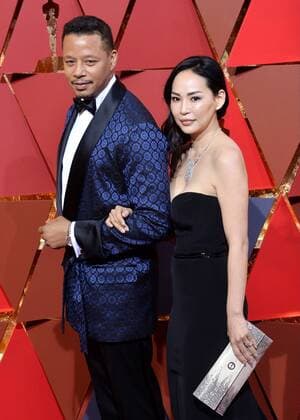 Actor Terrence Howard (L) and Mira Pak arrive on the red carpet for the 89th annual Academy Awards at the Dolby Theatre in the Hollywood section of Los Angeles on February 26, 2017.  LAP20170226878 JIMxRUYMEN