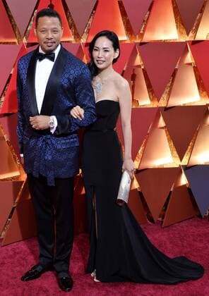 Actor Terrence Howard (L) and Mira Pak arrive on the red carpet for the 89th annual Academy Awards at the Dolby Theatre in the Hollywood section of Los Angeles on February 26, 2017.  LAP20170226879 JIMxRUYMEN