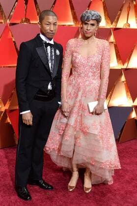 Musician Pharrell Williams (L) and producer Mimi Valdez arrive on the red carpet for the 89th annual Academy Awards at the Dolby Theatre in the Hollywood section of Los Angeles on February 26, 2017.  LAP20170226079 JIMxRUYMEN