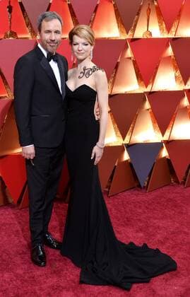 Director Denis Villeneuve (L) and Tanya Lapointe arrive on the red carpet for the 89th annual Academy Awards at the Dolby Theatre in the Hollywood section of Los Angeles on February 26, 2017.  LAP20170226475 JIMxRUYMEN