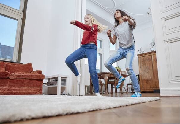 Two girls dancing at home model released Symbolfoto property released  RHF01806