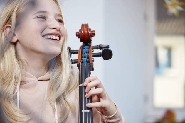 Portrait of happy girl with cello model released Symbolfoto property released  RHF01815