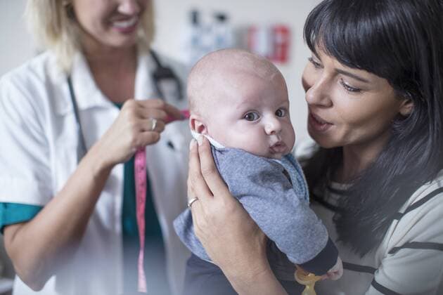 Mother and baby at a pedeatric examination model released Symbolfoto property released  ZEF12733
