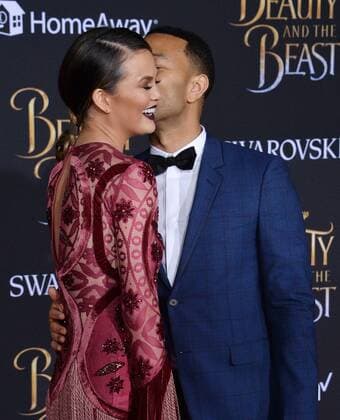 Model Chrissy Teigen and singer John Legend attend the premiere of the motion picture romantic musical fantasy Beauty and the Beast at the El Capitan Theatre in the Hollywood section of Los Angeles on March 2, 2017. Storyline: A young prince, imprisoned in the form of a beast, can be freed only by true love. What may be his only opportunity arrives when he meets Belle, the only human girl to ever visit the castle since it was enchanted.  LAP2017030239 JIMxRUYMEN