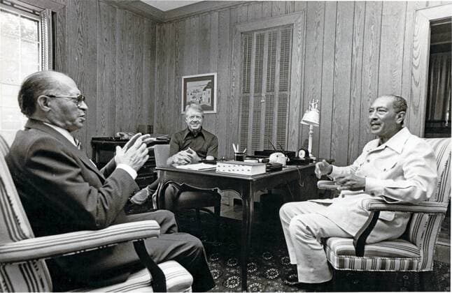 Jan. 6, 2011 - Thurmont, Maryland, United States of America - President Anwar al-Sadat of Egypt, right, listens to Premier Menachem Begin of Israel, left, as United States President Jimmy Carter, center, looks on September 6, 1978 at Camp David, the U.S. presidential retreat in Thurmont, Maryland. .Mandatory - ZUMAs152 20110106_zaa_s152_001 Copyright: xKarlxSchumacherx