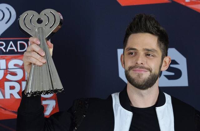 Singer-songwriter Thomas Rhett, winner of the Country Artist of the Year award appears backstage at the iHeartRadio Music Awards at The Forum in Inglewood, California on March 5, 2017. The show was broadcast live on Turner s TBS, TNT, and truTV .  LAP2017030507 JIMxRUYMEN
