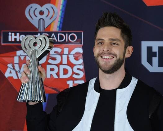 Singer-songwriter Thomas Rhett, winner of the Country Artist of the Year award appears backstage at the iHeartRadio Music Awards at The Forum in Inglewood, California on March 5, 2017. The show was broadcast live on Turner s TBS, TNT, and truTV .  LAP2017030509 JIMxRUYMEN