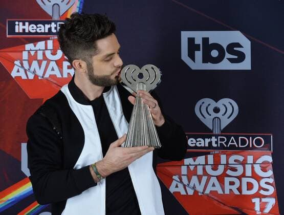 Singer-songwriter Thomas Rhett, winner of the Country Artist of the Year award appears backstage at the iHeartRadio Music Awards at The Forum in Inglewood, California on March 5, 2017. The show was broadcast live on Turner s TBS, TNT, and truTV .  LAP2017030510 JIMxRUYMEN