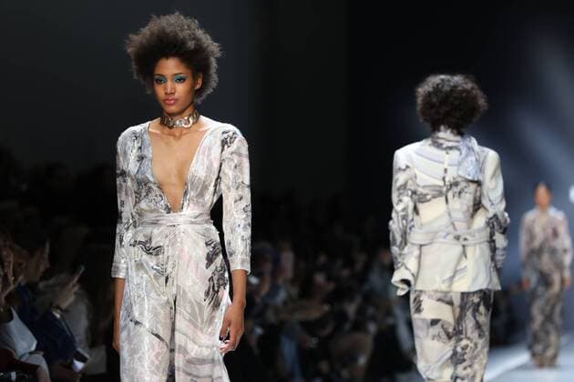 A model takes to the catwalk during the presentation of Leonard Paris show as part of the Fall-Winter 2017-18 Paris Fashion Week on March 6, 2017.  PAR20170306102 MAYAxVIDON-WHITE