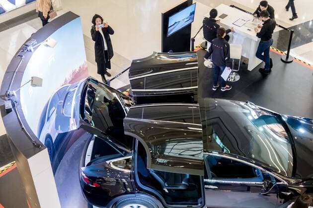 March 9, 2017 - Shanghai, Shanghai, China - Shanghai, CHINA-March 9 2017: (EDITORIAL USE ONLY. CHINA OUT)..A black Tesla Model X shows at a shopping mall in Shanghai, March 9th, 2017. The Tesla Model X is a full-sized, all-electric, luxury, crossover SUV made by Tesla Inc. that uses falcon wing doors for access to the second and third row seats. Shanghai China  - ZUMAs145 20170309_zaa_s145_101 Copyright: xWangxGangx