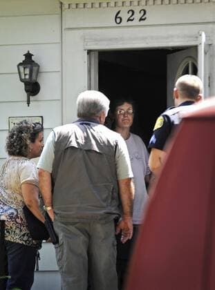 Aug. 1, 2008 - Diane Ivins talks with representatives of the Frederick City Police Department, on the stoop of her house in Frederick, Maryland, August 1, 2008. Her husband, Bruce E. Ivins, 62, worked at Fort Detrick as a research microbiologist and was involved with the anthrax investigations of 2001. He died Tuesday of drug overdose. ( Baltimore Sun MCT) - ZUMAm67_ 20080801_baf_m67_212 Copyright: xChristopherxT.xAssafx