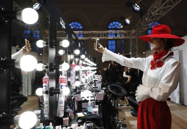 MOSCOW, RUSSIA - MARCH 12, 2017: A model takes a selfie backstage before a catwalk show for a spring summer 2017 collection by Slava Zaitsev at the 2017 Mercedes-Benz Fashion Week Russia in the Manege Central Exhibition Hall. Artyom Geodakyan TASS  TS043F71