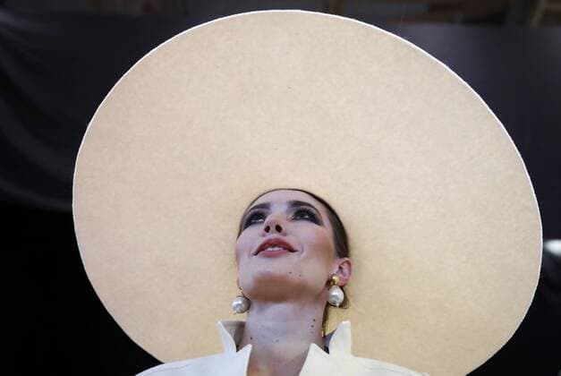 MOSCOW, RUSSIA - MARCH 12, 2017: A model wearing a hat is pictured backstage before a catwalk show for a spring summer 2017 collection by Slava Zaitsev at the 2017 Mercedes-Benz Fashion Week Russia in the Manege Central Exhibition Hall. Artyom Geodakyan TASS  TS043F72