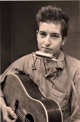 FILE PHOTO - BOB DYLAN, American singer songwriter, poet, folk and rock musician is celebrating his 70th birthday. Dylan sings, plays guitar, harmonica and piano and is considered one of the most influential music makers of the 20th Century. PICTURED - Jan. 19, 2007 - Minneapolis, Minnesota, U.S. - Image of BOB DYLAN with a harmonica around his neck and a guitar in his arms at the Weisman Museum Exhibit Journey 1956-1966 - Bob Dylan . - ZUMAm42_ 20070119_zaf_m42_002 Copyright: xMinneapolisxStarxTribunex
