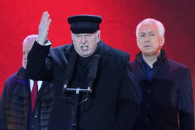MOSCOW, RUSSIA - MARCH 18, 2017: Russian State Duma s Deputy Chairman Vladimir Vasilyev (R) looks on as Russian Liberal Democratic Party Leader Vladimir Zhirinovsky (C) speaks at a concert marking the 3rd anniversary of Crimea s reunification with Russia, by the Moscow State University main building. Vyacheslav Prokofyev TASS  TS044BEF