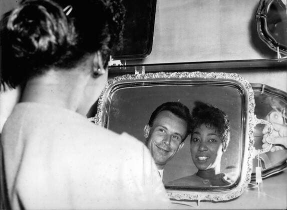 May 05, 1959 - Gloria Davy, the wellknown American singer, was visiting during her tournee through Germany the Wurttembergische Metall a mirror, amused her and her piano-partner Donal Nold. - ZUMAk09_ 19590505_baf_k09_236 Copyright: xKeystonexPressxAgencyx
