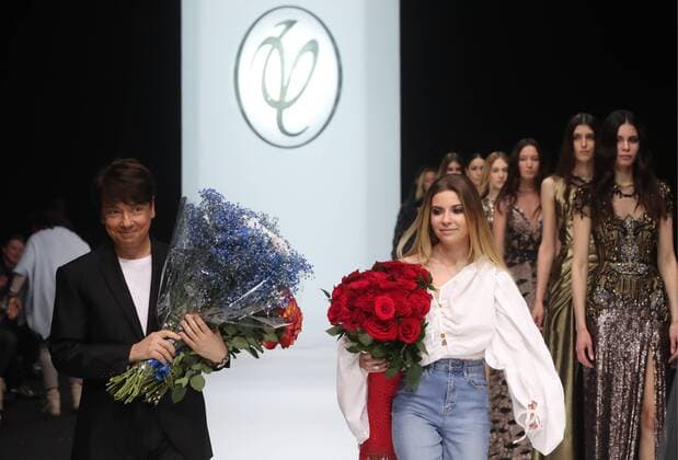 MOSCOW, RUSSIA - MARCH 21, 2017: Russian fashion designer Valentin Yudashkin and his daughter Galina (front) receive flowers after a runway show for Yudashkin s Fall Winter 2017 pret-a-porter collection at the 37th Moscow Fashion Week at Moscow s Gostiny Dvor Shopping and Exhibition Centre. Stanislav Krasilnikov TASS  TS04504E