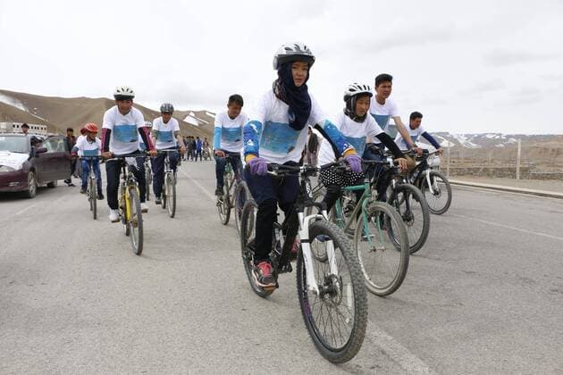 (170323) -- BAMYAN, March 23 -- Afghan girls ride bicycles during a cycling event on Farmer s Day in Bamyan province, central Afghanistan , March 22, 2017. The Afghans celebrated Farmer s Day across the country by holding ceremonies and displaying agricultural products and livestock.Latif Azimi) (SP)AFGHANISTAN-BAMYAN-CYCLING EVENT-FARMER S DAY XinhuaxKabul 