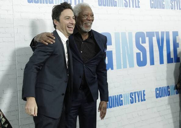 Morgan Freeman and Zach Braff leap arrive on the red carpet at the Going in Style World Premiere at SVA Theatre on March 30, 2017 in New York City.  NYP20170330122 JOHNxANGELILLO